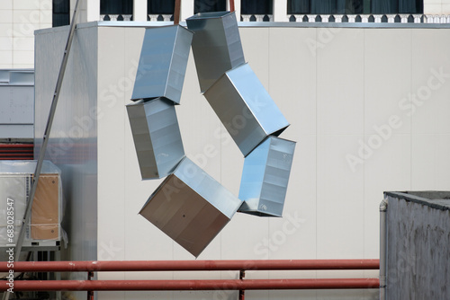 Tubes of the ventilation ducts made of galvanized steel hanged on the rope
