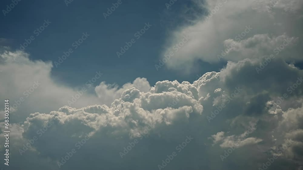 Time lapse of white to blueish grey storm clouds building in a blue sky. The clouds are slowly developing into thunderheads.
Time lapse of white to blueish grey storm clouds building in a blue sky. The clouds are slowly developing into thunderheads.