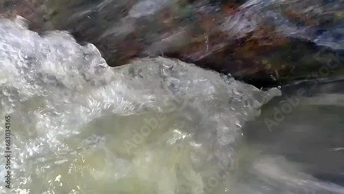 watercourse with a small waterfall, close-up