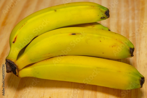 Ripe nanica bananas in selective focus photo