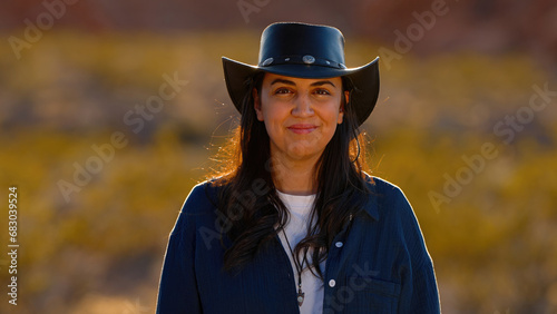 Portrait shot of a cowgirl in the desert at sunset - travel photography © 4kclips
