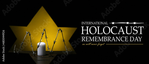 Banner for International Holocaust Remembrance Day with burning candle and barbed wire photo