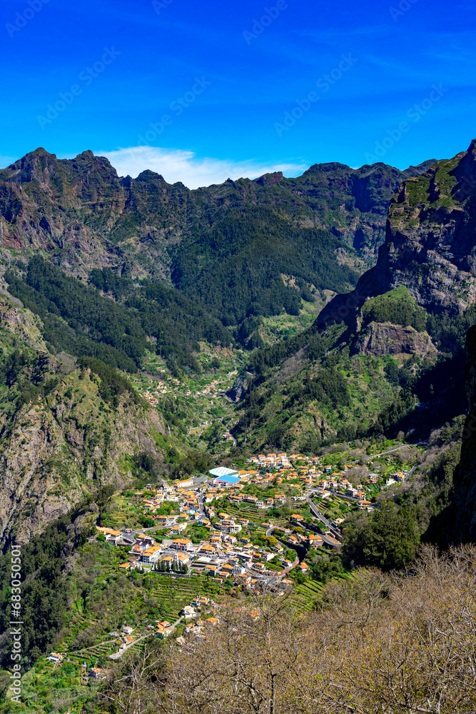 locality of Curral das Freiras inserted in the lower part of a grandiose valley seen from above through the eira do cerrado viewpoint on the island of Madeira.