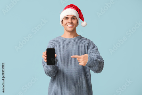 Handsome young man in Santa...