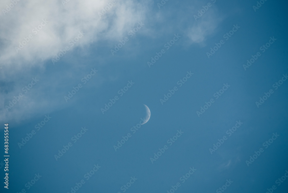 Crescent moon in a cileo with clouds at sunset Crescent moon in a cileo with clouds at sunset