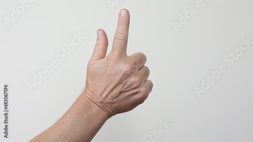 a man's hands making pointing gestures upwards against a clean white background, the clarity and expressiveness of the hand gestures. © lililia