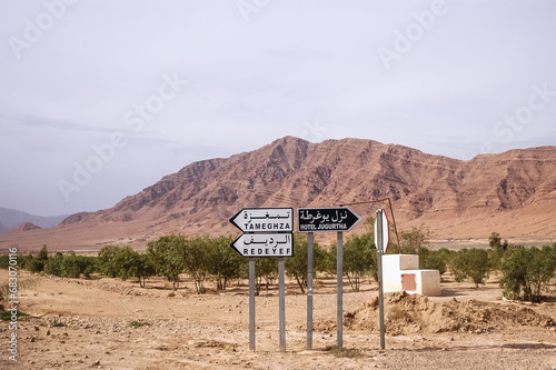 Mountains in Gafsa Governorate, view with road direction signs, Tunisia