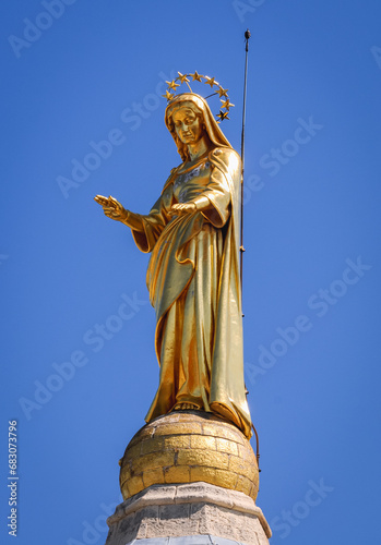 Statue of Virgin Mary on Notre-Dame des Doms - Avignon Cathedral in Avignon city, France photo