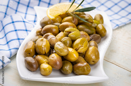 Cracked green olives. Crack...