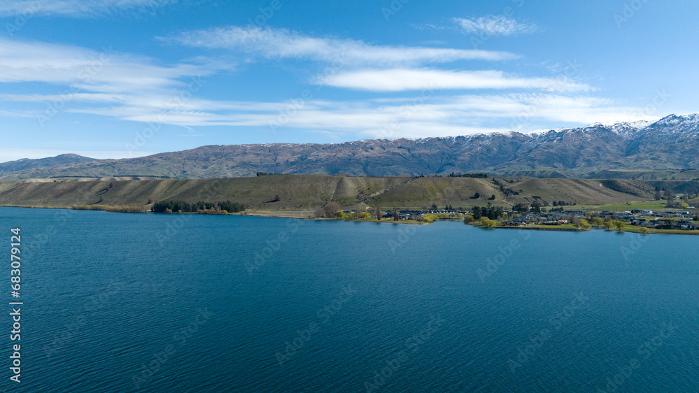 Panoramic aerial drone views of Lake Dunstan and its mountainous shoreline in central Otago