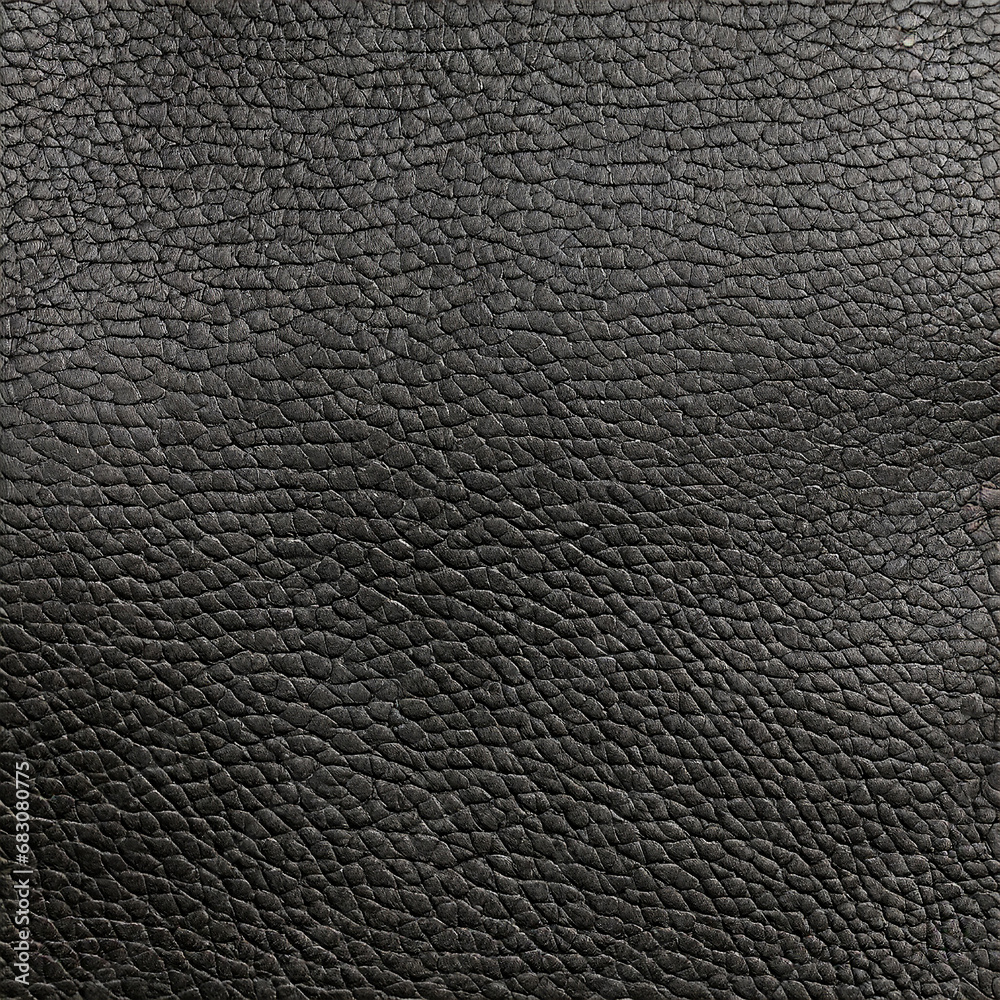 Black Leather texture close up as background. The material for the goods
