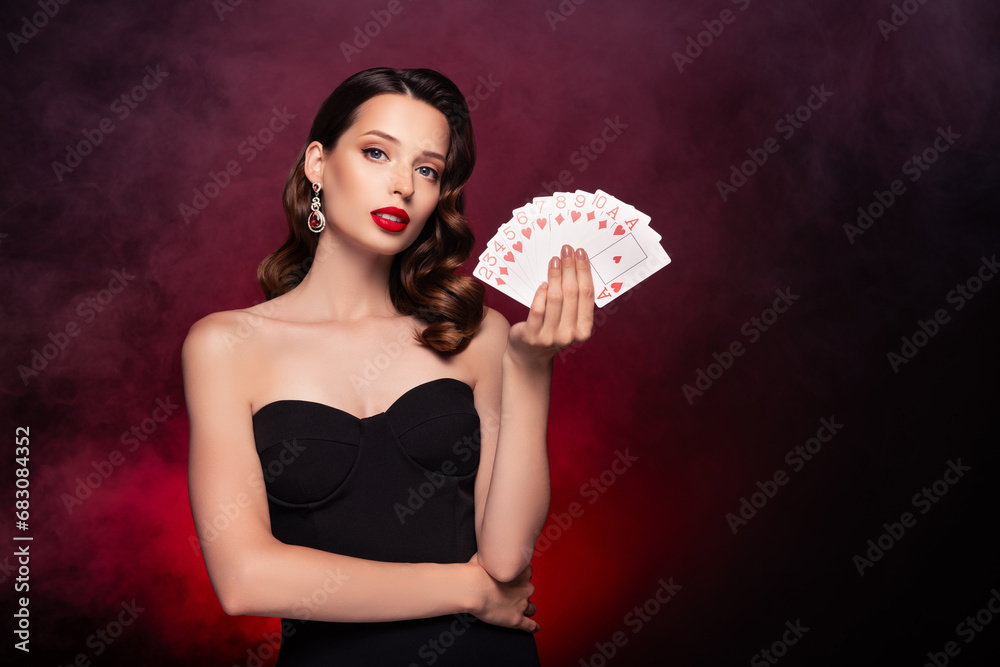 Photo of classy gorgeous lady professional poker player hold flash royal win fortune over mist background Photo of classy gorgeous lady professional poker player hold flash royal win fortune over mist background