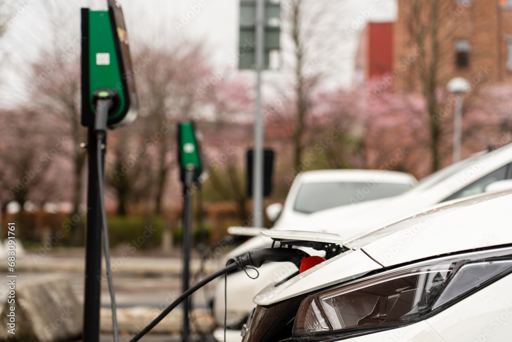 Electric car charging on the street