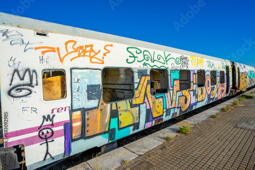 Vandalized train carriages with paintings without artistic expression, only with drawings with destructive intent, installed in the old railway station in the city of Barreiro.