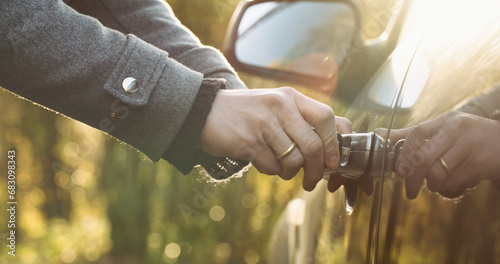 Woman unlocking a car door with a key. Travel and mobility concept photo