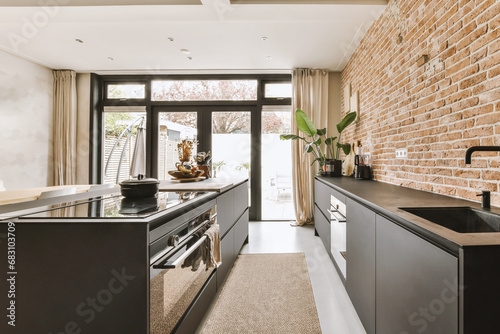 Kitchen with appliances and black countertop