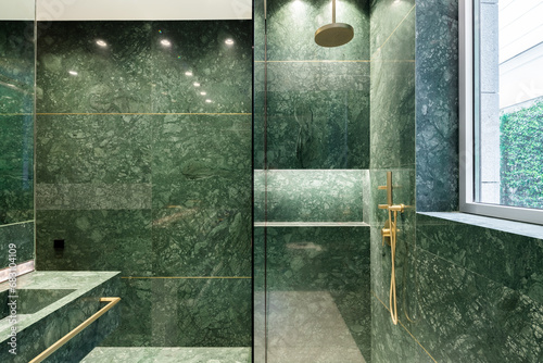 Green bathroom with shower booth and sink photo