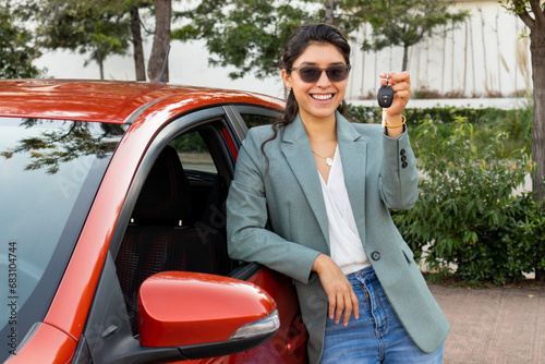 Cheerful entrepreneur demonstrating vehicle key
