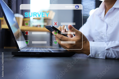 Businessman answer online questionnaire as a organization survey or company to feedback satisfaction or information to provide guidelines for future business investment and operation