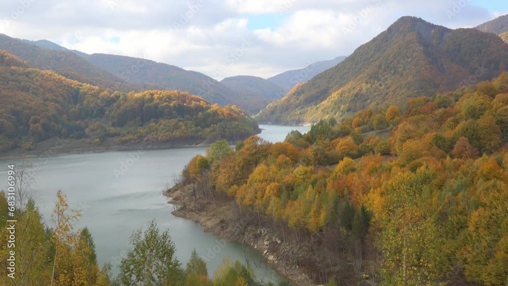 Scenic fall landscape with colorful mountains and lake Scenic fall landscape with colorful mountains and lake