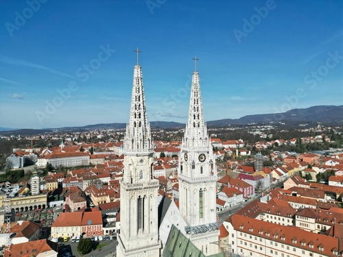 Aerial view of Zagreb City featuring two prominent steeples perched atop its skyline
