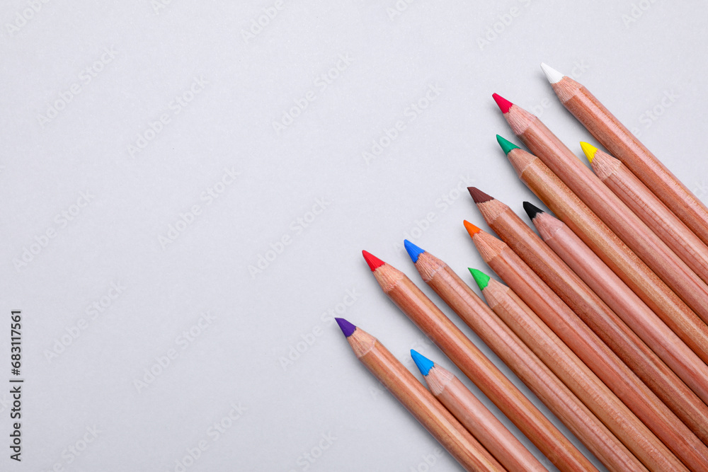 Colorful pastel pencils on white background, flat lay with space for text. Drawing supplies Colorful pastel pencils on white background, flat lay with space for text. Drawing supplies