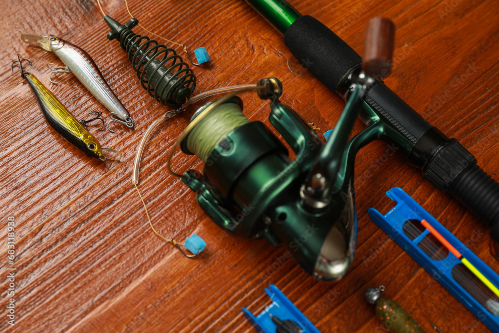 Fishing tackle on wooden table, closeup view Fishing tackle on wooden table, closeup view
