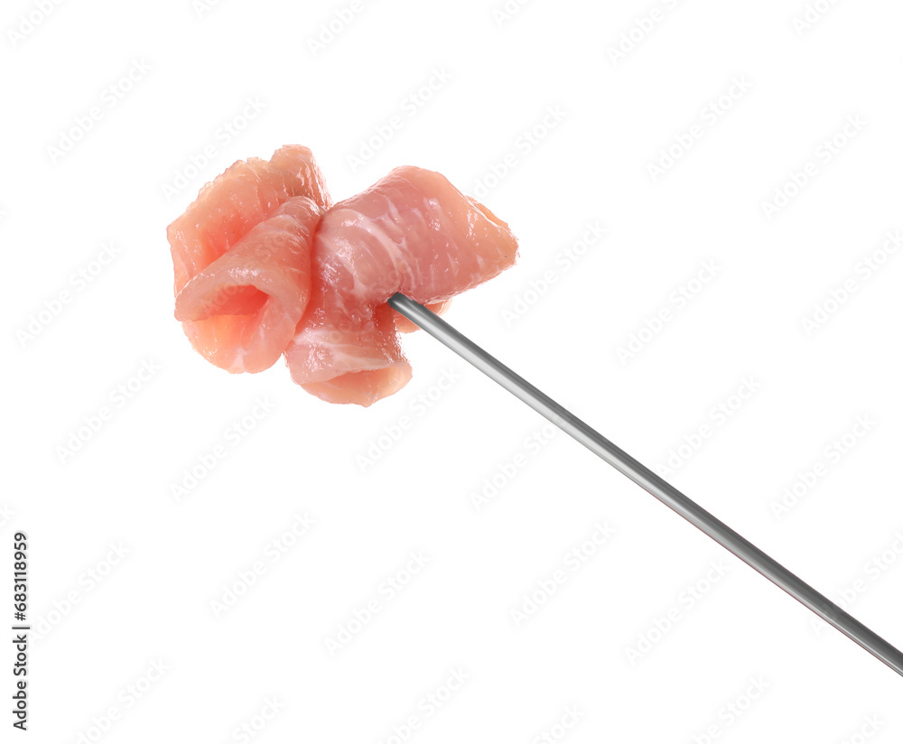 Fondue fork with pieces of raw meat isolated on white Fondue fork with pieces of raw meat isolated on white