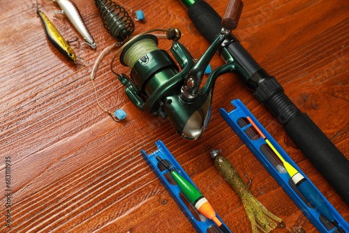 Fishing tackle on wooden table, space for text