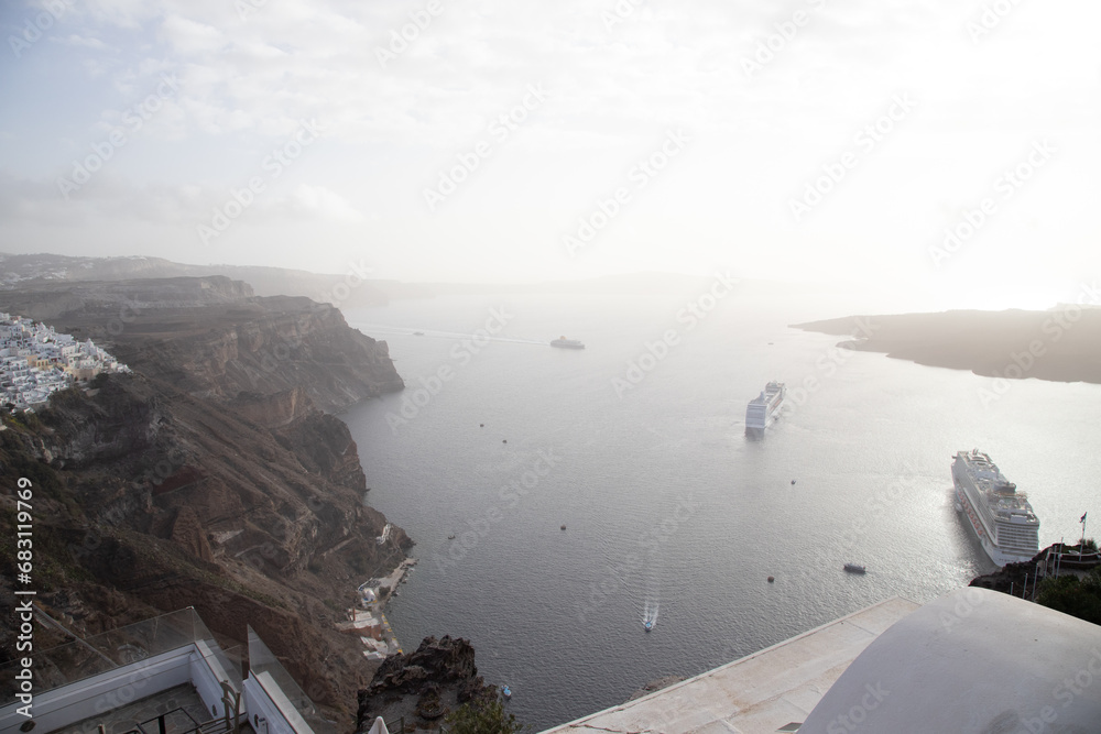 Two cruise ships anchored in Santorini, Greece - obrazy, fototapety, plakaty 