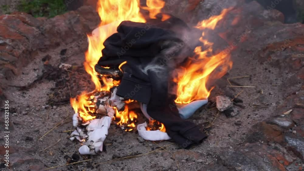 threw his pants into the fire. High quality FullHD footage threw his pants into the fire. High quality FullHD footage