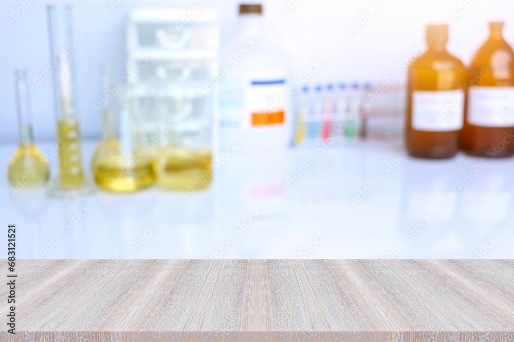 The wooden table is empty and laboratory background