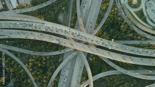 Drone top down rotating above Interstate Freeway I10 and I610 at sunset, Houston Texas photo