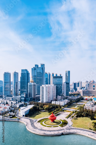 Aerial photography of the coastline and skyline of Qingdao May Fourth Square, Shandong, China