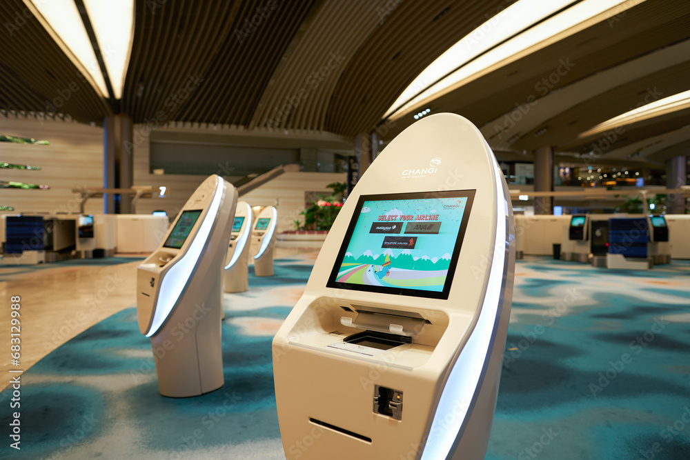 SINGAPORE - NOVEMBER 06, 2023: self check-in kiosks in Singapore Changi ...