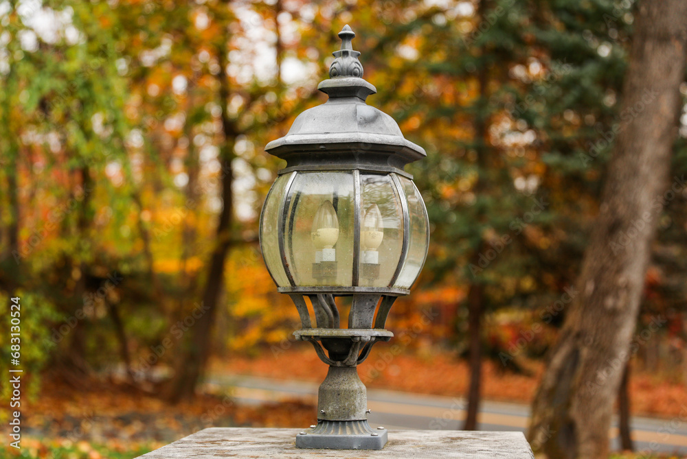 Glowing street lamp illuminates a serene urban night scene with soft light and inviting ambiance Glowing street lamp illuminates a serene urban night scene with soft light and inviting ambiance