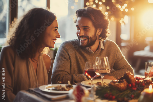 Happy couple friends celebrating at christmas dinner in sunny dining room