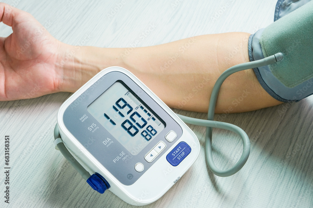 Man check blood pressure monitor and heart rate monitor with digital pressure gauge. Health care and Medical concept
Man check blood pressure monitor and heart rate monitor with digital pressure gauge. Health care and Medical concept