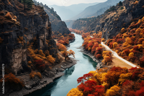 fresh and pure enchanting beauty of a gorge during autumn season when viewed from above, with blazing foliage, meandering river, and sense of nature's artistic transformation