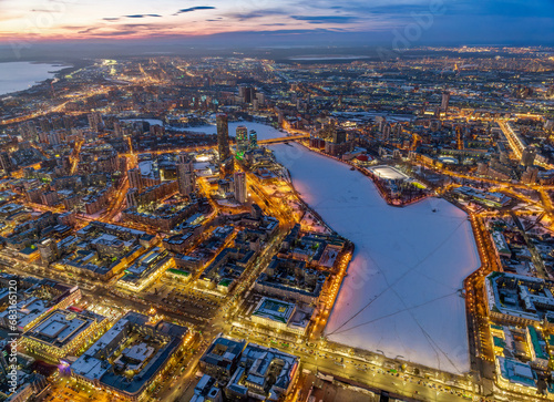 Embankment of the central pond and Plotinka in Yekaterinburg at winter sunset. The historic center of the city of Yekaterinburg, Russia, Aerial View