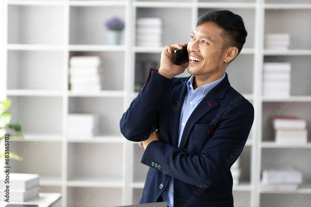 Businessman in office using smartphone to send message and call to someone on mobile phone. Businessman in office using smartphone to send message and call to someone on mobile phone.