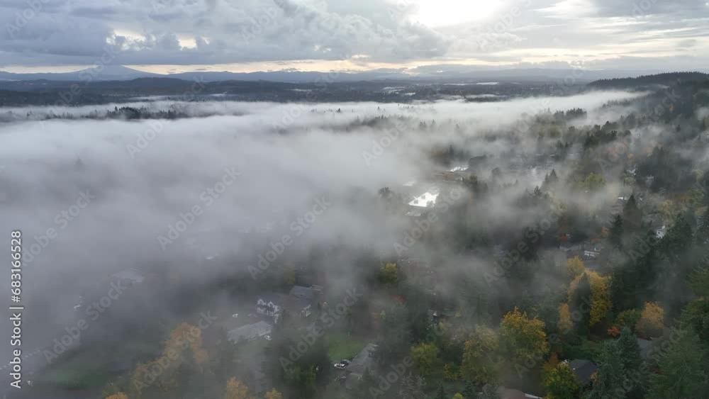 Early morning mist drifts across the Willamette River and the surrounding valley in Oregon near Portland. This Pacific Northwest region has dramatic weather much of the year.