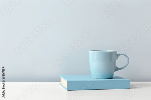 Blue cup of coffee with blue notebook Blue monday concept.