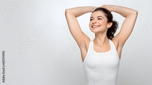 Happy young woman in white tank top raising her arms up to her head with a cheerful expression on her face Generative AI