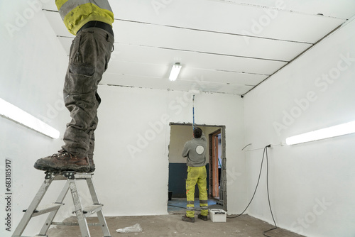Professional Painters paint a Spacious Room or Garage, making it newer. © oleksandr