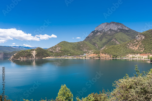 The reflection of blue sky and white clouds on the water surface of Lugu Lake in China