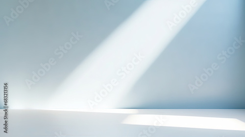 Abstract minimal empty light blue and white 3d room background. Modern Studio showcase with copy space. Mock up scene with natural window shadows  dappled light overlay effect. empty room