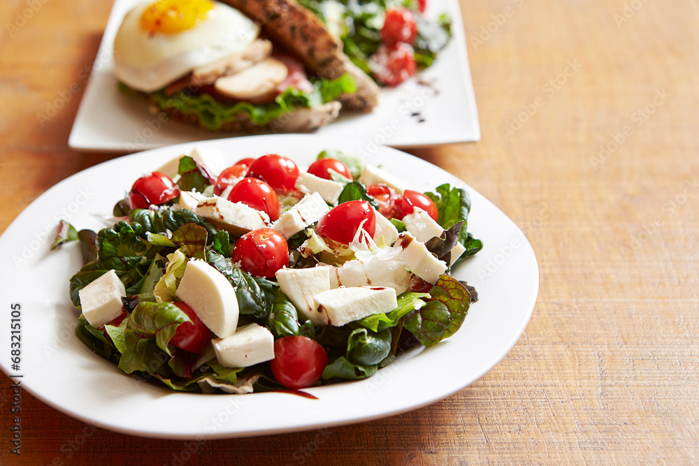 Salad with cheese and cherry tomatoes Salad with cheese and cherry tomatoes