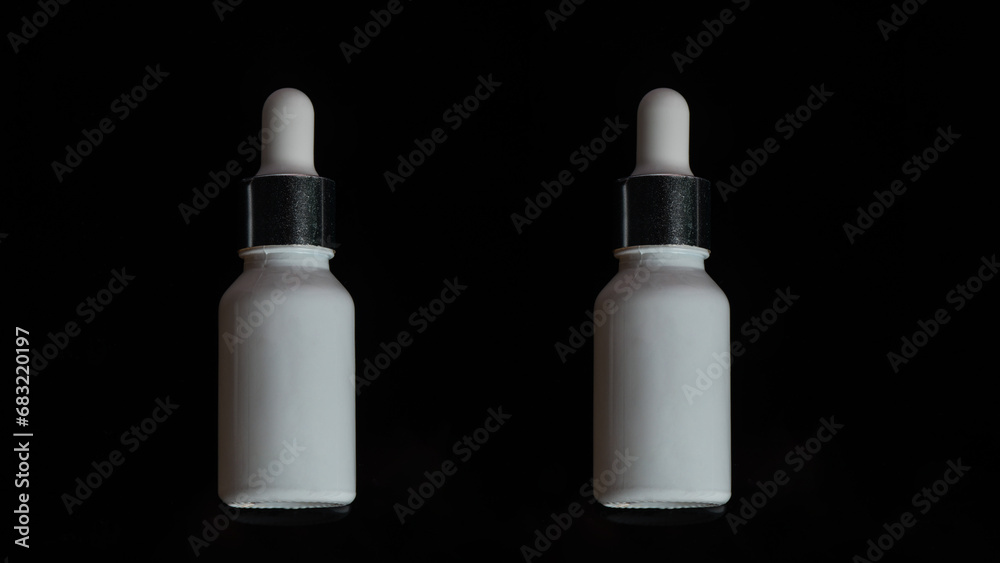 Plastic white tube for cream or lotion. Skin care or sunscreen cosmetic on black background. Plastic white tube for cream or lotion. Skin care or sunscreen cosmetic on black background.