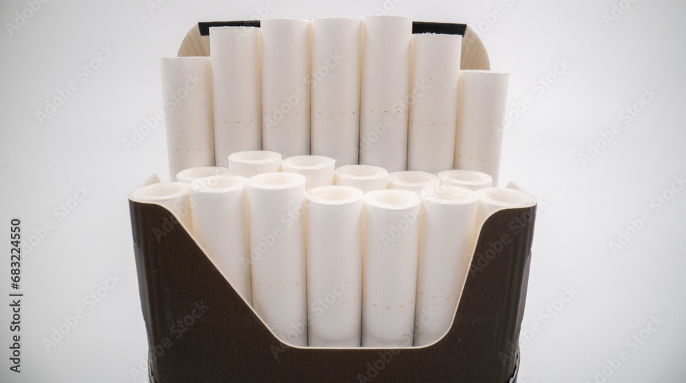 Cigarettes in a cigarette pack on white background isolated. Cigarettes in a cigarette pack on white background isolated.